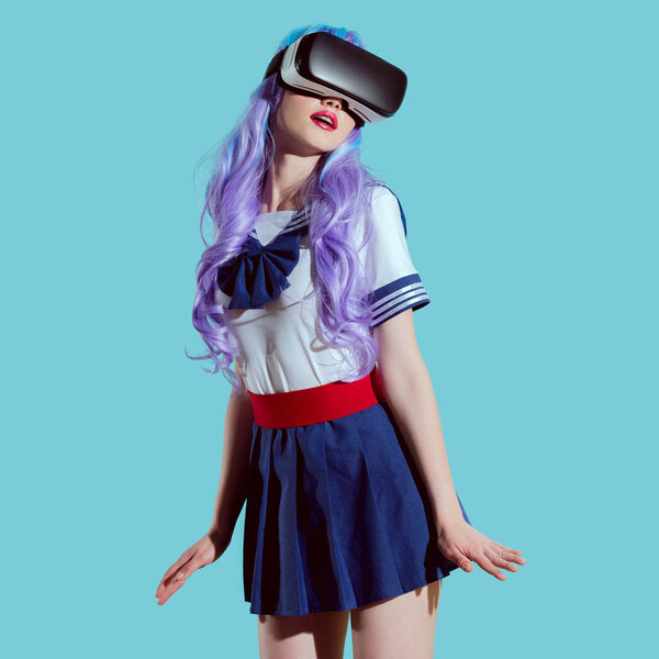 stylish girl in bright wig using virtual reality headset isolated on blue