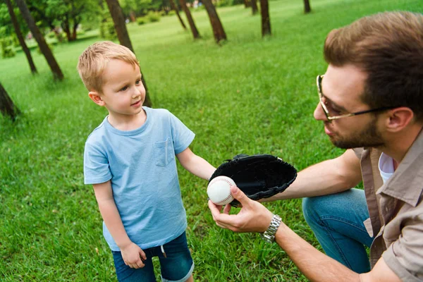 Father Giving Son Baseball Ball Glove Park — Stock Photo, Image