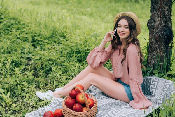 Young Smiling Woman Talking Smartphone While Resting Blanket Wicker Basket — Stock Photo, Image