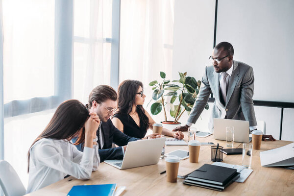 multicultural business people having business meeting in office