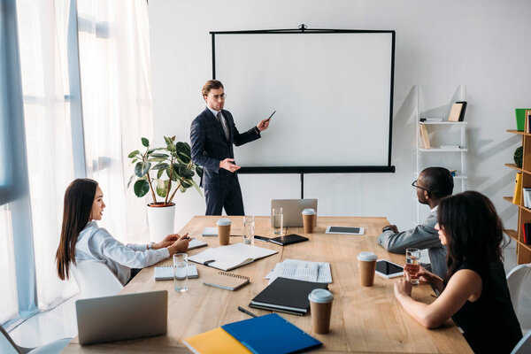 multicultural business people having business meeting in office