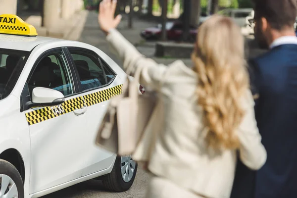 Selective Focus Young Woman Waving Hand While Going Man Taxi — Stock Photo, Image