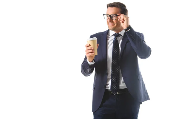 Smiling Businessman Adjusting Eyeglasses Holding Paper Cup Coffee Isolated White — Stock Photo, Image