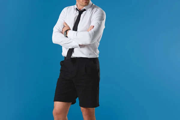 Cropped Image Stylish Man Shorts Crossed Hands Isolated Blue Background — Free Stock Photo
