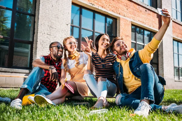 Smiling Multiethnic Friends Taking Selfie Smartphone While Resting Green Lawn — Stock Photo, Image