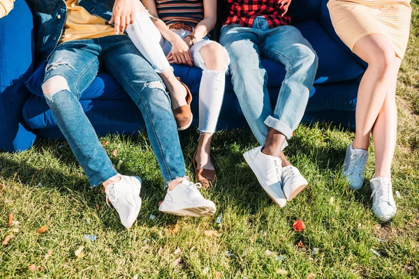 Cropped Shot Interracial Friends Resting Blue Sofa Together Park — Free Stock Photo