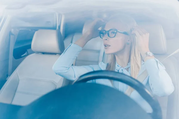 Blonde Businesswoman Eyeglasses Looking Rear View Mirror Car — Stock Photo, Image