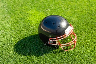 high angle view of american football helmet lying on grass