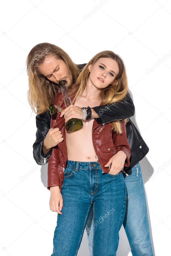 epatage young addicted couple with water pipe smoking marijuana on white