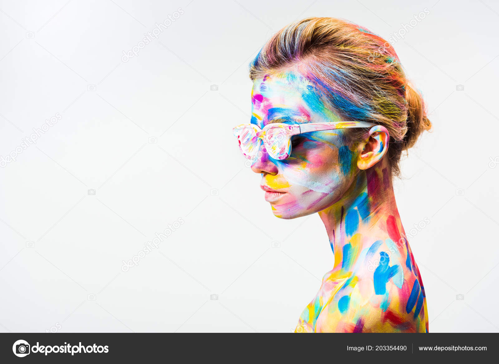 Side view attractive girl colorful bright body art sunglasses isolated photo