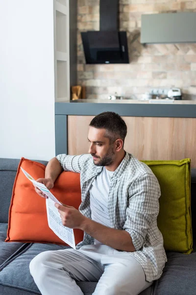 Portrait Focused Man Reading Newspaper Sofa Home — Stock Photo, Image