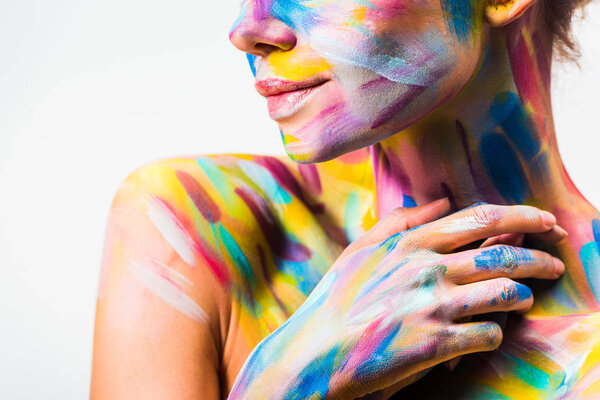 cropped image of girl with colorful bright body art touching neck isolated on white 