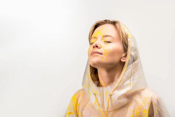 Beautiful Woman Raincoat Painted Yellow Paint Standing Closed Eyes Isolated — Stock Photo, Image