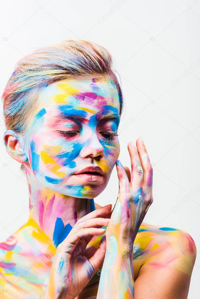 attractive girl with colorful bright body art touching hand isolated on white 