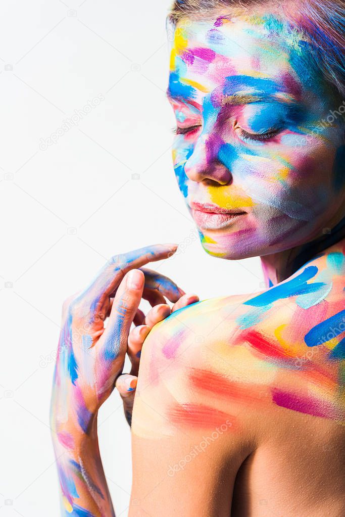 side view of attractive girl with colorful bright body art with closed eyes isolated on white 