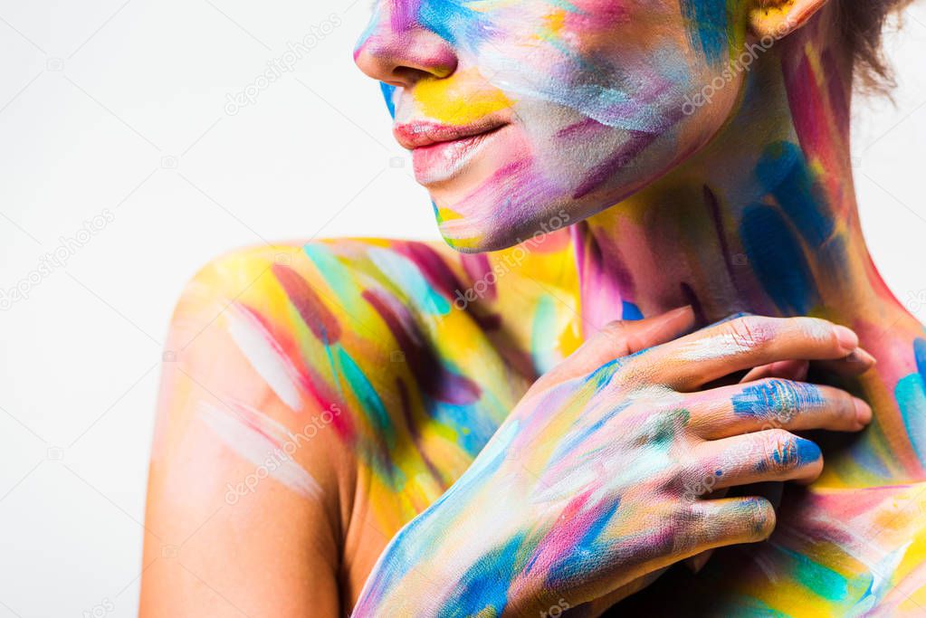 cropped image of girl with colorful bright body art touching neck isolated on white 