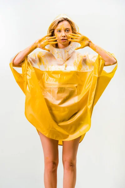 Beautiful Woman Raincoat Painted Yellow Paint Showing Painted Hands Isolated — Free Stock Photo