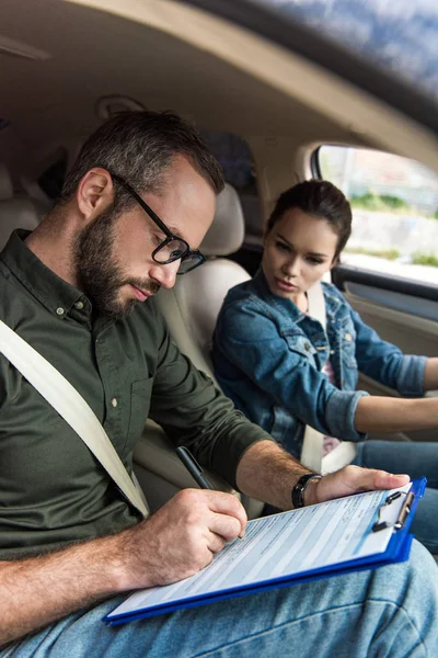 Teacher Writing Something Clipboard Driving Test — Stock Photo, Image