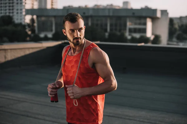 Handsome Sportsman Jumping Rope Red Shirt Looking Away Roof — Stock Photo, Image