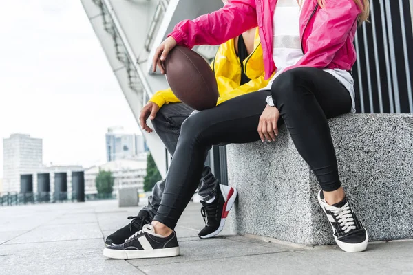 Cropped Image Young Smiling Couple Sitting Rugby Ball Urban City — Stock Photo, Image