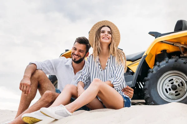 Smiling Young Couple Sitting Atv Sandy Dune — Stock Photo, Image