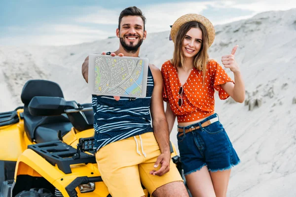 Smiling Young Couple Atv Showing Digital Tablet Map Screen Thumb — Stock Photo, Image