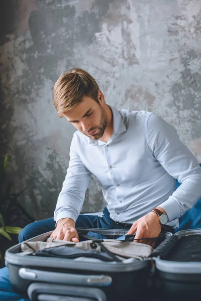 Focused Businessman Packing Luggage Suitcase Bedroom Home — Free Stock Photo