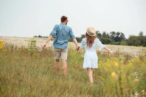 Back View Young Lovers Holding Hands While Running Field Wild — Stock Photo, Image