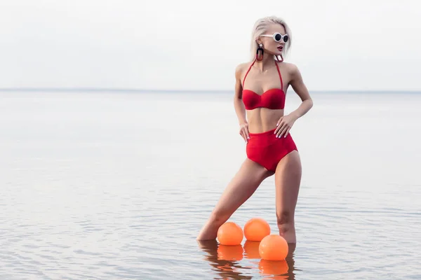 Stylish Woman Trendy Red Bikini Sunglasses Standing Water Balls — Stock Photo, Image