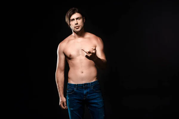 Portrait Shirtless Man Jeans Showing Middle Finger Camera Isolated Black — Free Stock Photo