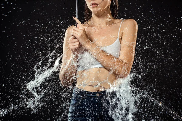 Partial View Woman Umbrella Swilled Water Isolated Black — Free Stock Photo