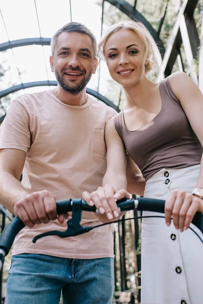 Low Angle View Smiling Parents Looking Baby Carriage Park — Stock Photo, Image