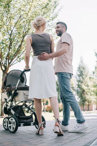 Back View Happy Parents Walking Baby Carriage Park — Stock Photo, Image