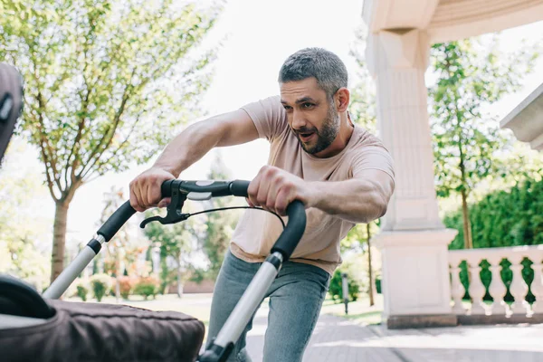 Father Having Fun Walking Baby Carriage Park — Stock Photo, Image