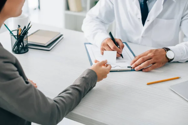 Cropped Image Patient Giving Card Doctor Fill Insurance Claim Form — Stock Photo, Image