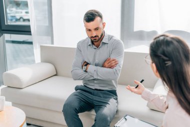 psychologist and patient talking in clinic, mental health concept clipart