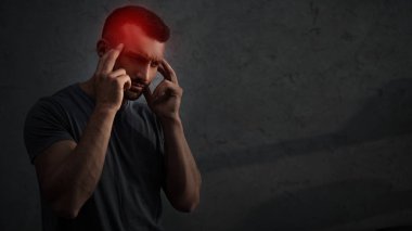 tired upset man suffering from headache with red painful point on head clipart