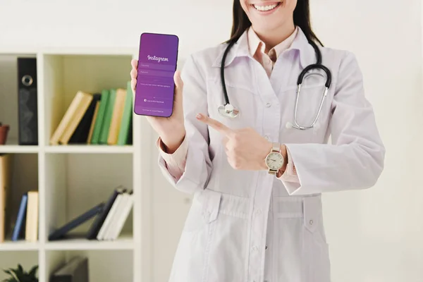 Cropped View Doctor Pointing Smartphone Instagram Appliance — Stock Photo, Image