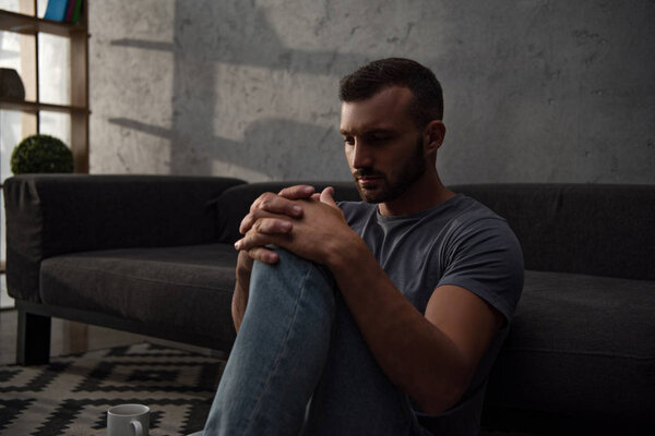 lonely depressed man sitting at home
