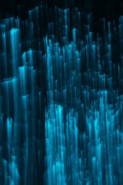 abstract glittering blue lights on black background  clipart