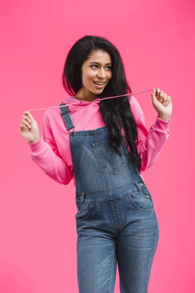 Smiling African American Woman Tying Hoodie Laces Looking Away Isolated — Free Stock Photo