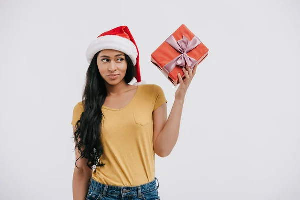 Skeptical African American Girl Santa Hat Holding Present Isolated White — Free Stock Photo