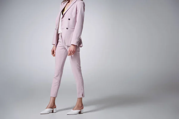 Cropped Shot Woman Stylish Pink Suit Walking Grey — Free Stock Photo