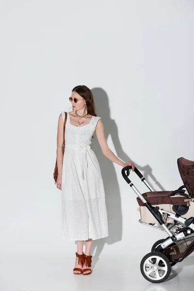 Stylish Woman White Dress Sunglasses Standing Baby Carriage Looking Away — Stock Photo, Image