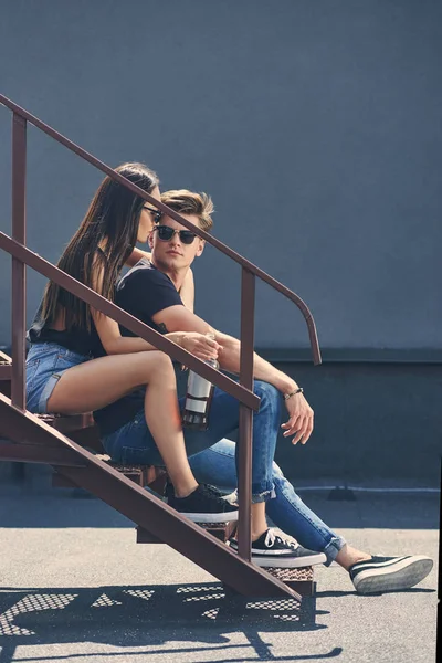 Multicultural Couple Bottle Rum Embracing Sitting Urban Stairs — Stock Photo, Image