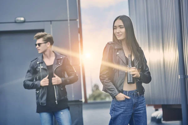 Interracial Couple Bottle Beer Standing Roof Backlit — Free Stock Photo