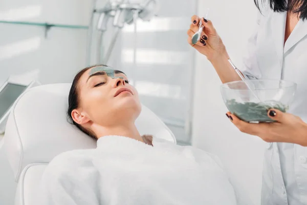 Partial View Cosmetologist Applying Clay Mask Female Face Spa Salon — Stock Photo, Image
