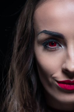 half face portrait of vampire with red eyes isolated on black clipart