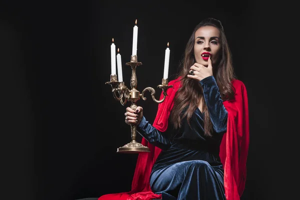 Evil Woman Red Cloak Holding Retro Candelabrum Licking Her Fingers — Stock Photo, Image