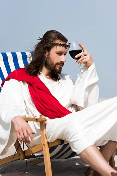 Pensive Jesus Robe Red Sash Sitting Sun Lounger Glass Red — Free Stock Photo